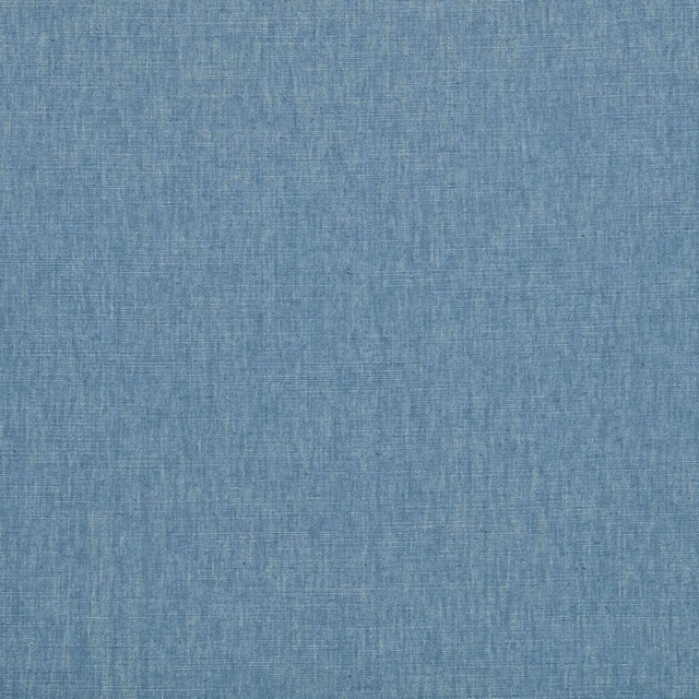 Muted denim-blue woven swatch with fine crosshatch texture and softly varied surface