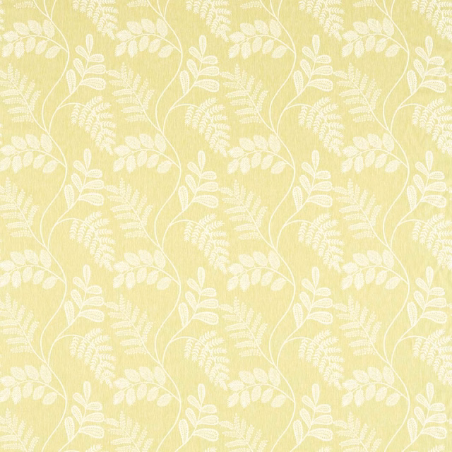 Pale citron fabric with white leafy vines and a softly textured ground