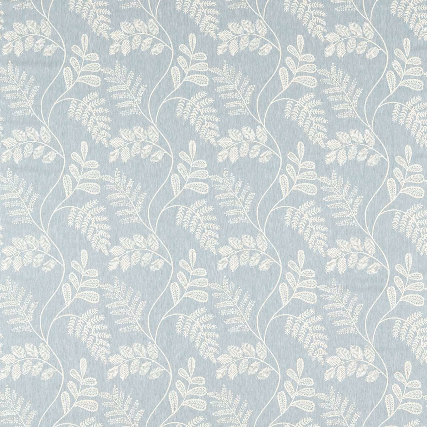 Muted denim-blue textile with ivory leafy stems, fern sprays and mottled ground