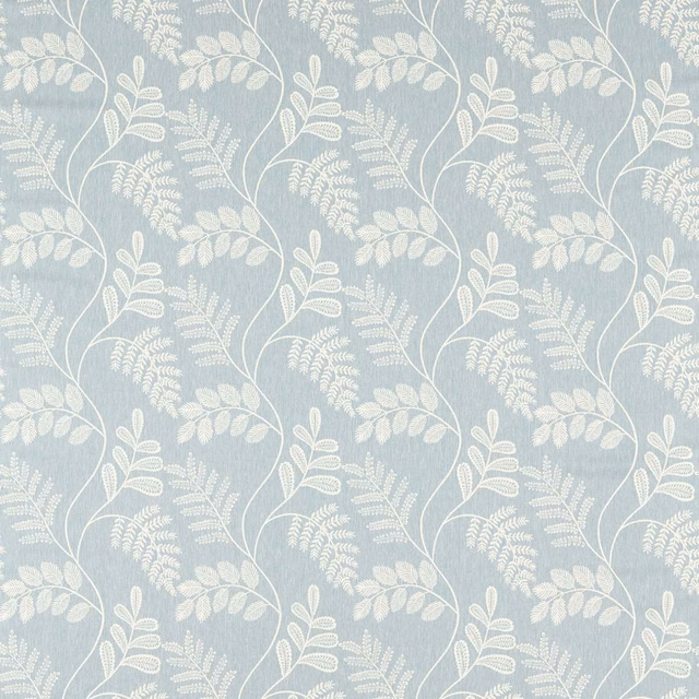 Muted denim-blue textile with ivory leafy stems, fern sprays and mottled ground