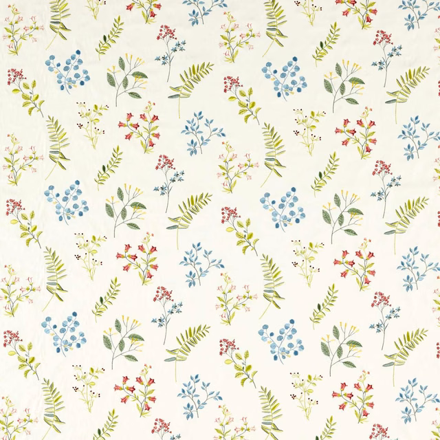Cream botanical fabric with blue sprigs, green leaves and small scattered flowers