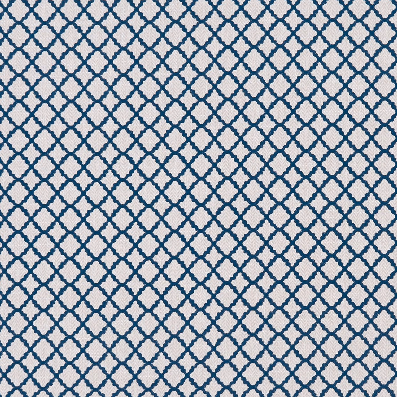 Cool denim-blue trellis pattern on a textured ivory upholstery fabric