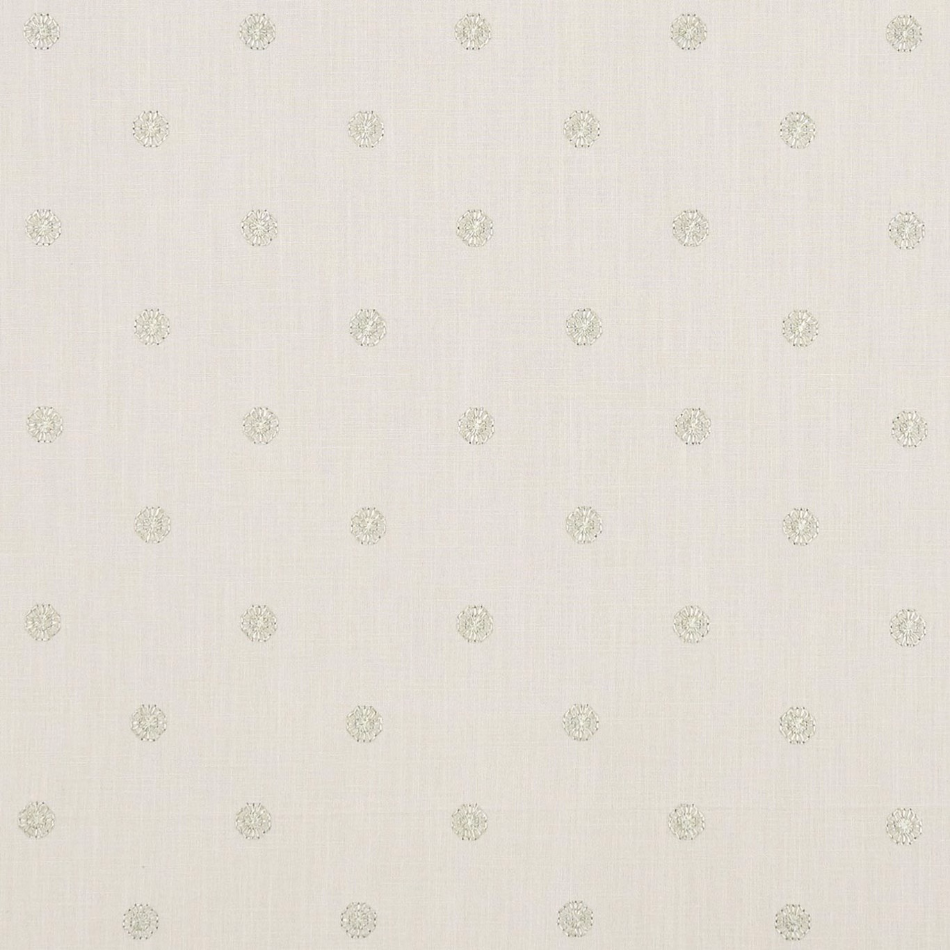 Champagne ivory woven fabric with small pale medallion motifs and subtle slub texture
