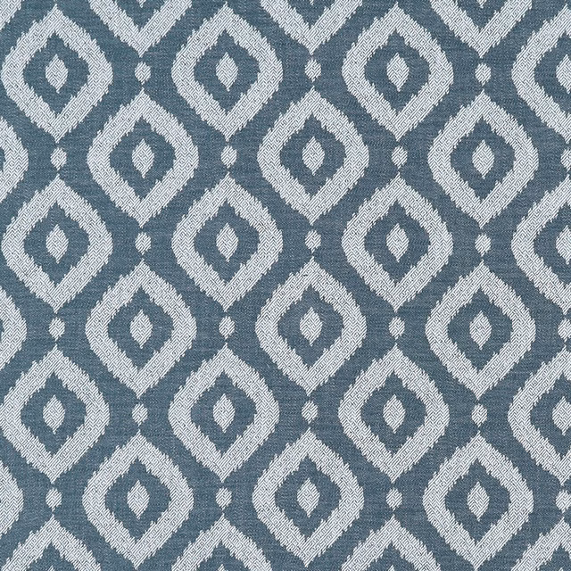Cool denim-blue woven ground with ivory diamond motifs and tiny linking dots