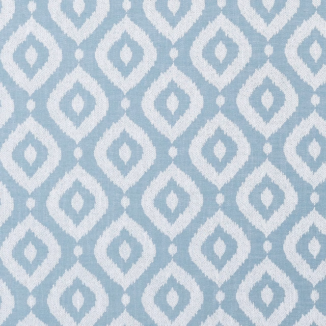Pale mineral-blue and ivory woven diamond motifs with a softly nubby texture