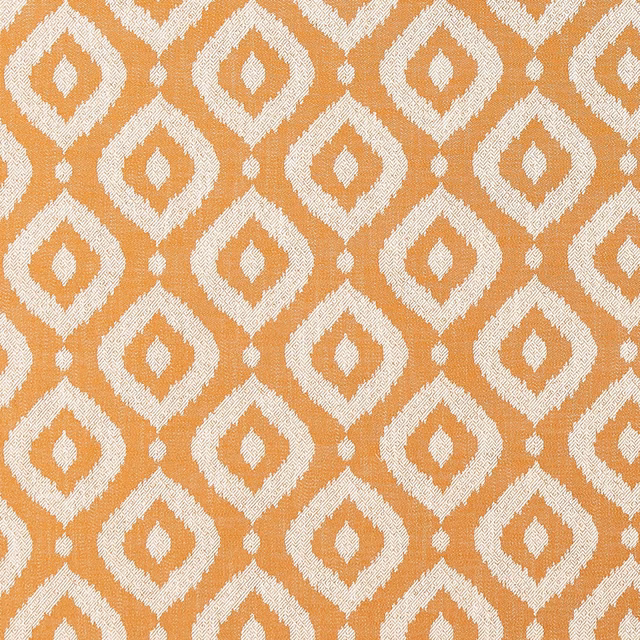 Burnt spice orange fabric with ivory textured diamond motifs in a repeating geometric weave