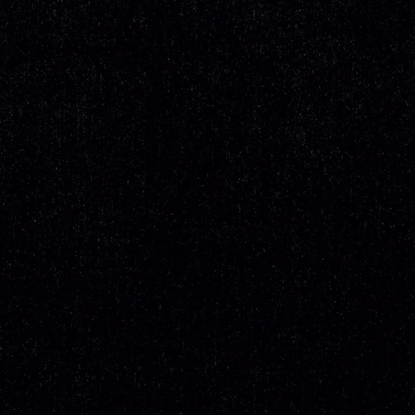 Near-black ebony textile with a barely flecked, softly textured surface
