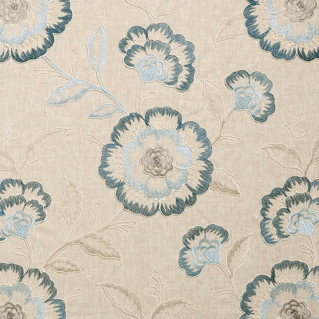 Beige woven ground with large denim-blue flowers and outlined leaves