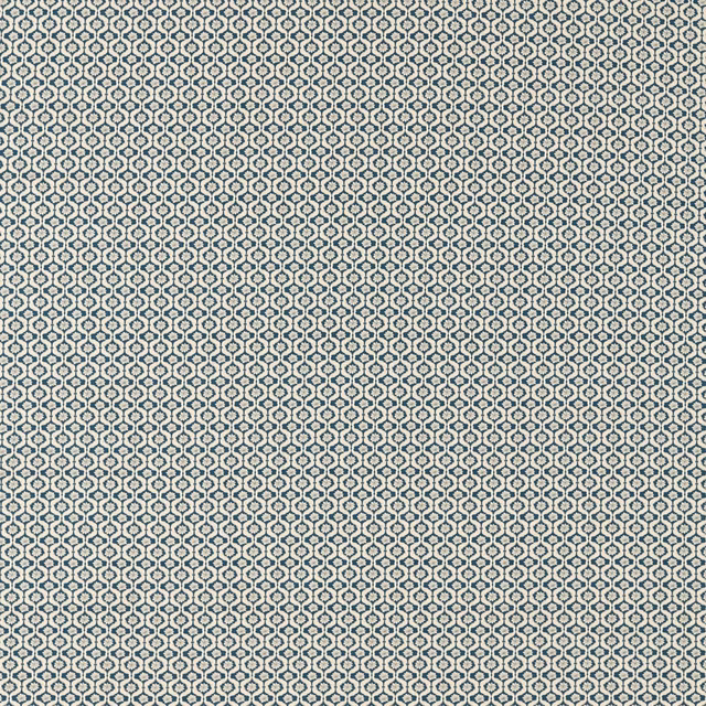 Midnight blue textile with densely repeated ivory geometric motifs and fine woven texture
