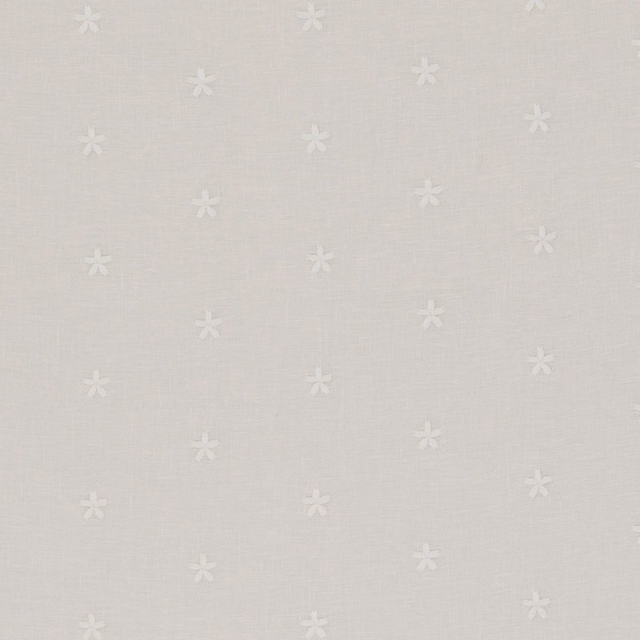 Pale ivory woven fabric with scattered small white flower motifs and fine texture