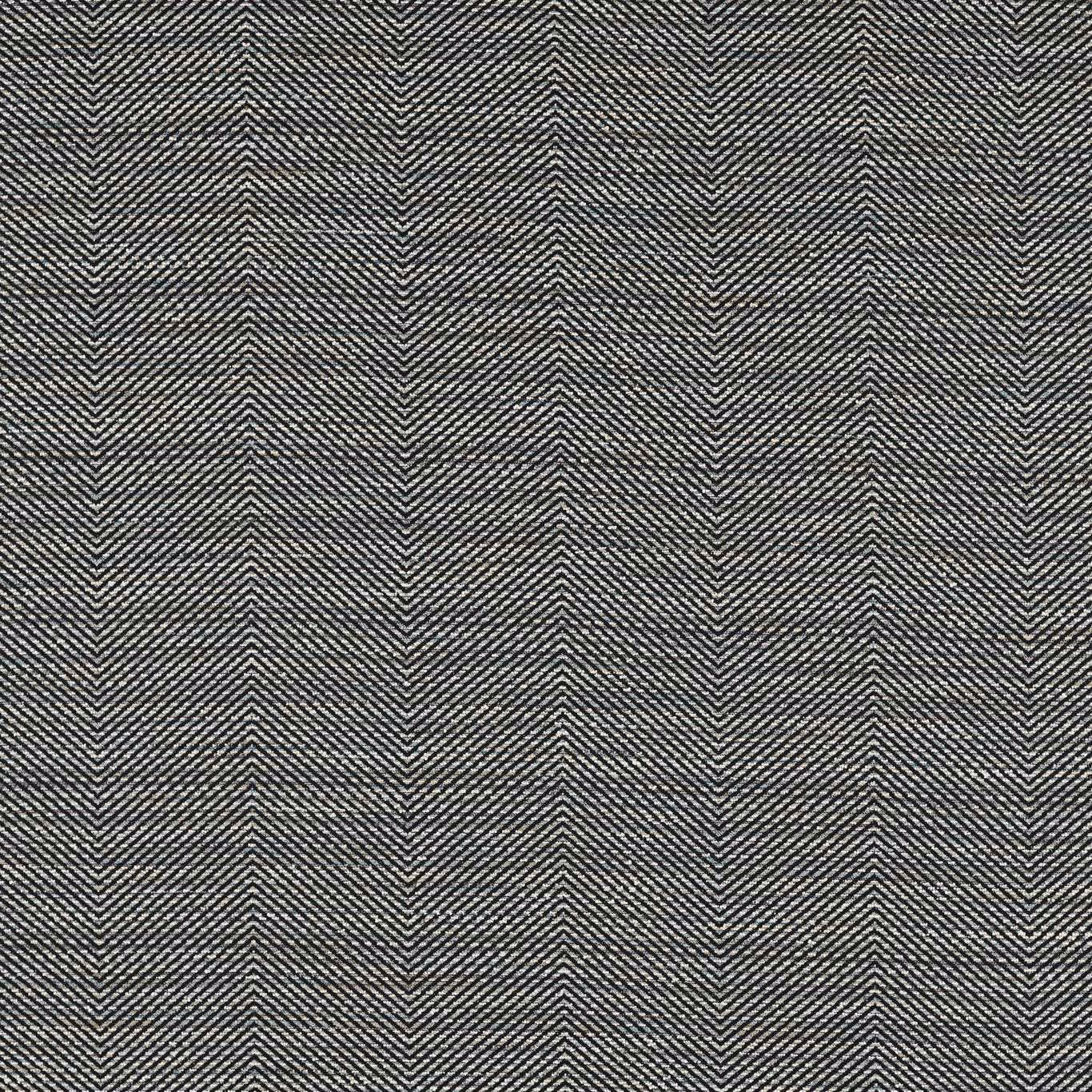 Close-up of deep charcoal grey woven herringbone fabric with fine salt-and-pepper texture.