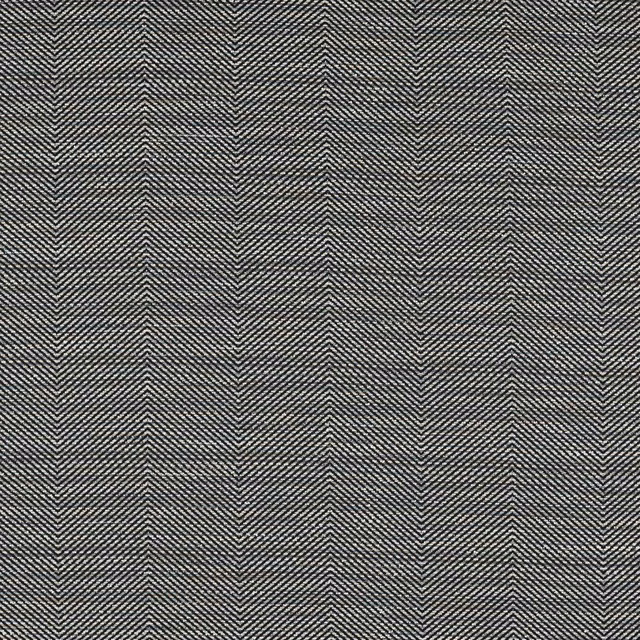 Close-up of deep charcoal grey woven herringbone fabric with fine salt-and-pepper texture.