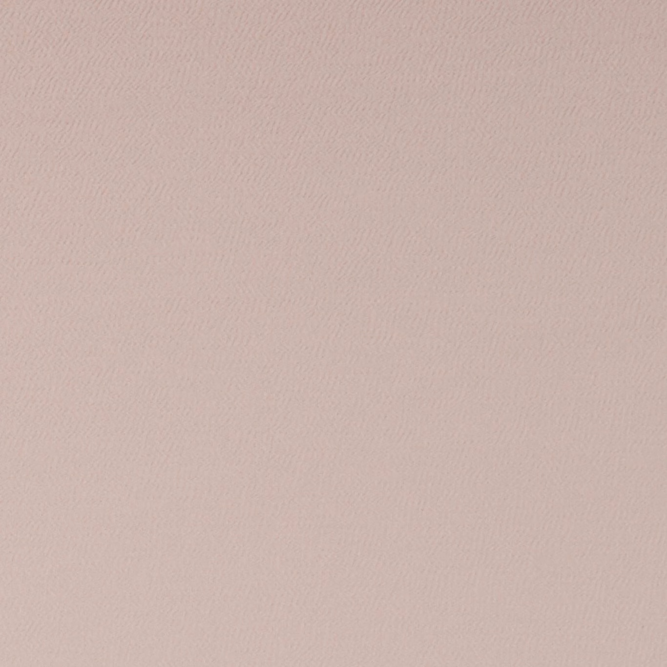 Pale blush pink woven fabric with a barely visible tonal textured motif