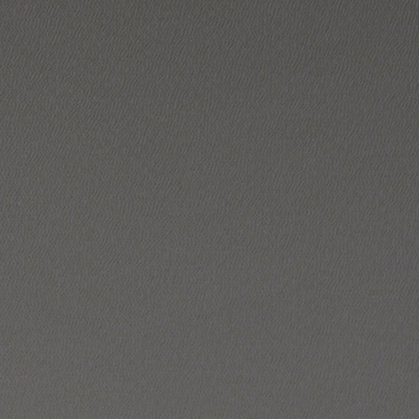 Close-up of deep charcoal grey fabric with a fine, subtly rippled woven texture