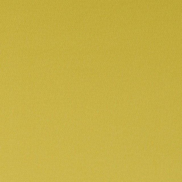 Close-up of bright chartreuse yellow-green fabric with a fine rippled woven texture