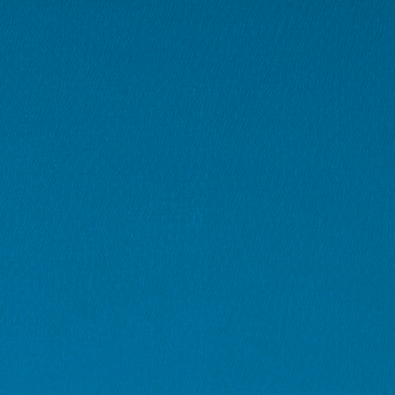 Close-up of saturated peacock teal cloth with a fine, softly rippled weave