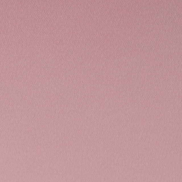 Dusty rose pink fabric with a fine, subtly rippled woven texture
