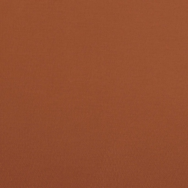 Warm terracotta-brown Spectrum fabric with a subtle fine woven grain