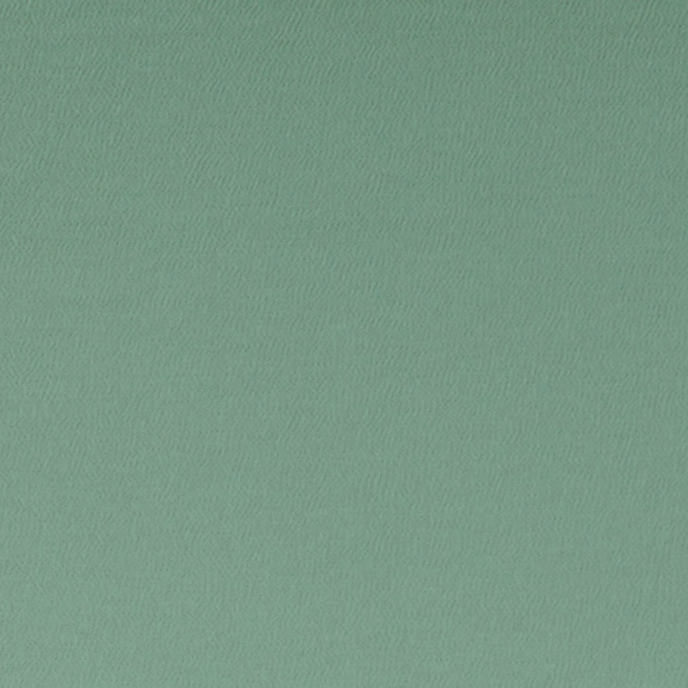 Close-up of muted thyme green fabric with a fine, subtly rippled woven texture