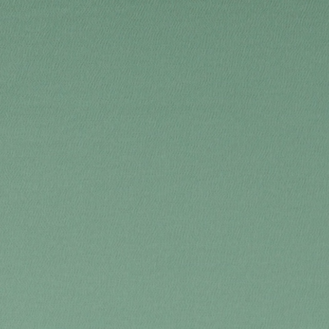 Close-up of muted thyme green fabric with a fine, subtly rippled woven texture