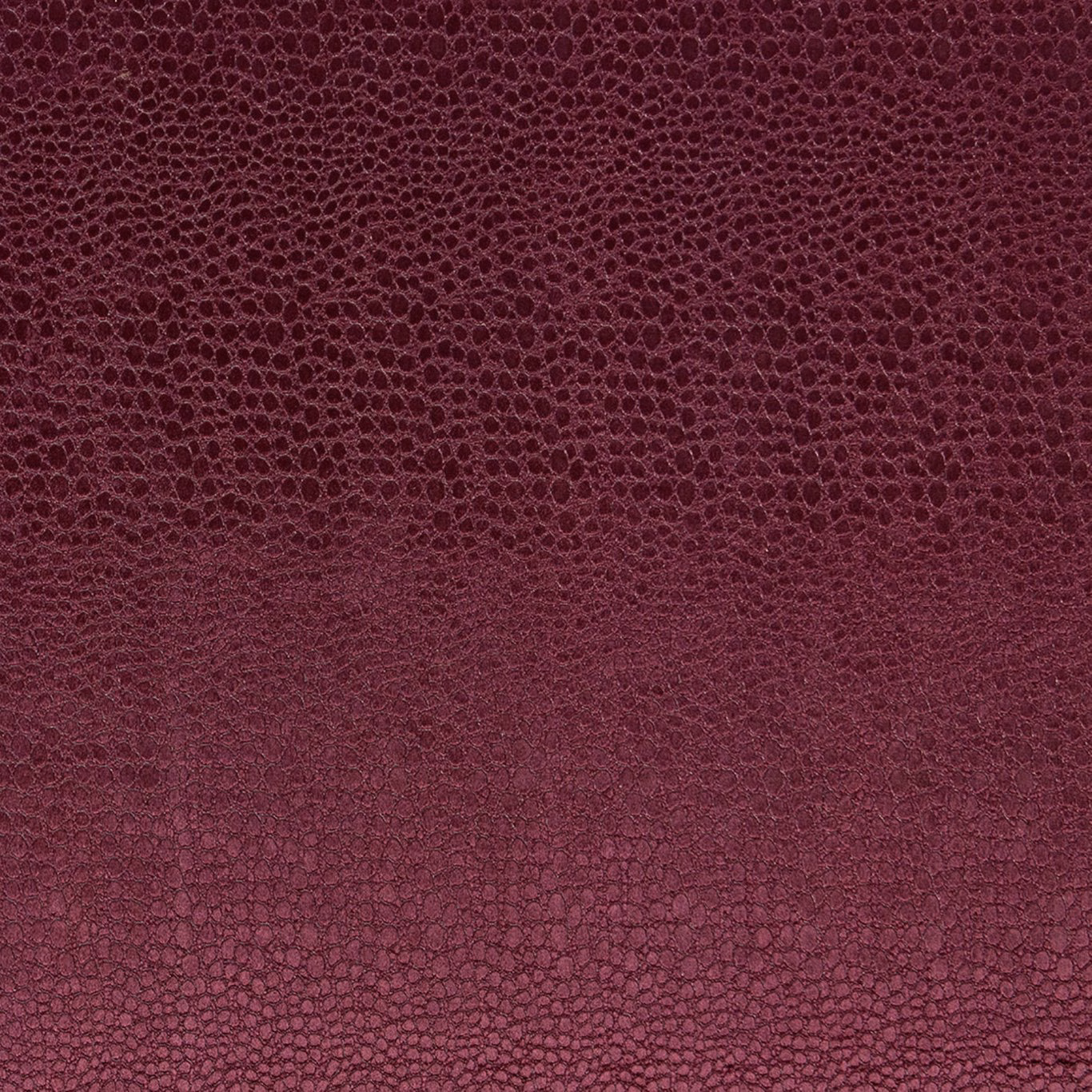 Deep damson velvet showing a small tonal pebble texture and shaded pile