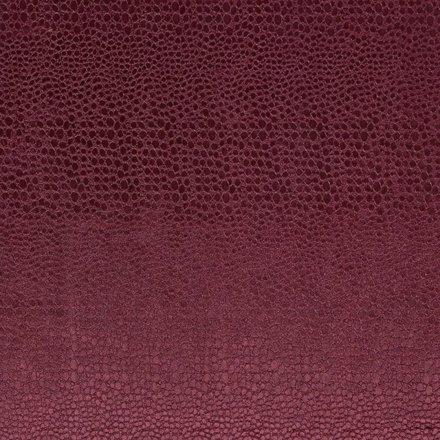 Deep damson velvet showing a small tonal pebble texture and shaded pile