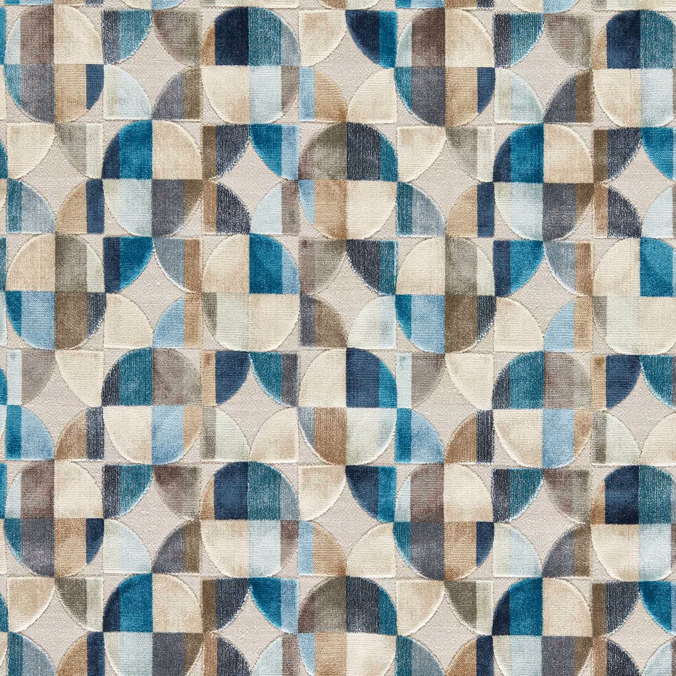 Denim blue geometric woven fabric with teal, cream, taupe and grey curved blocks