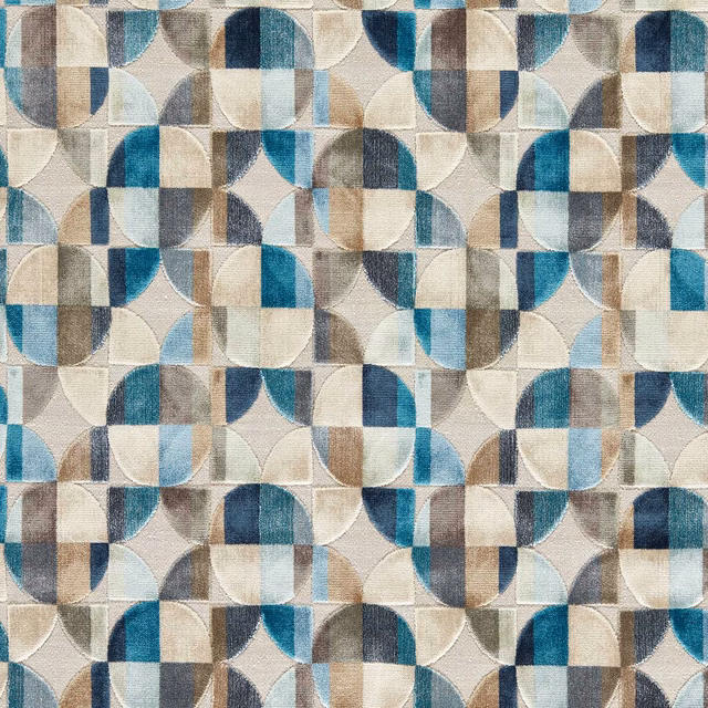 Denim blue geometric woven fabric with teal, cream, taupe and grey curved blocks