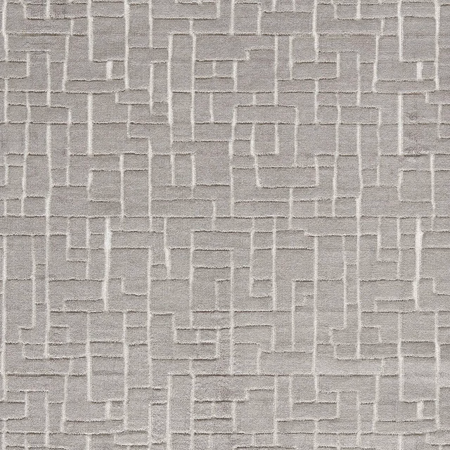 Cool slate-grey woven fabric with raised interlocking rectangular lines and soft texture