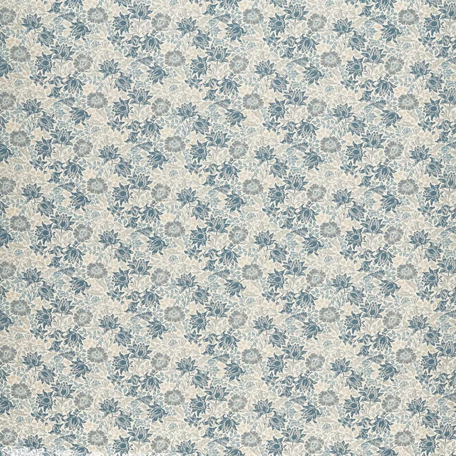 Dense muted blue floral jacquard motifs scattered across a pale cream ground