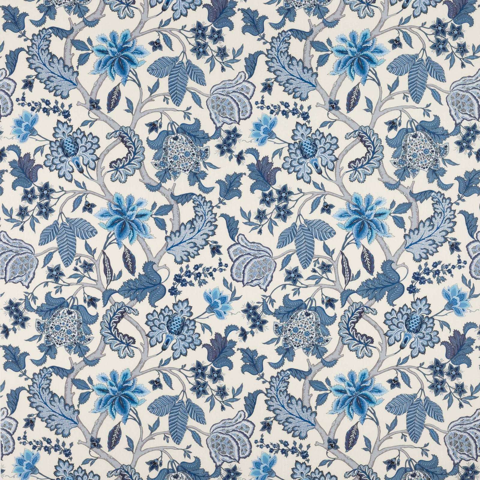 Blue floral linen fabric with scrolling vines on an ivory ground