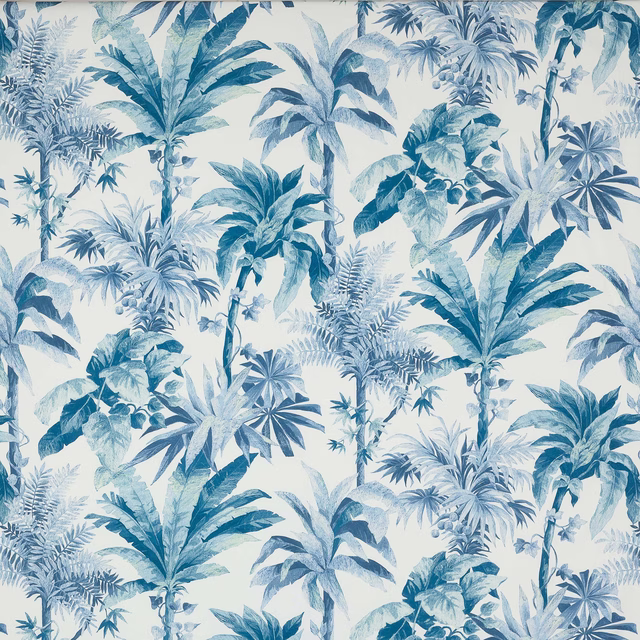 Large-scale tropical palm print in soft ciel and denim blues on a white ground