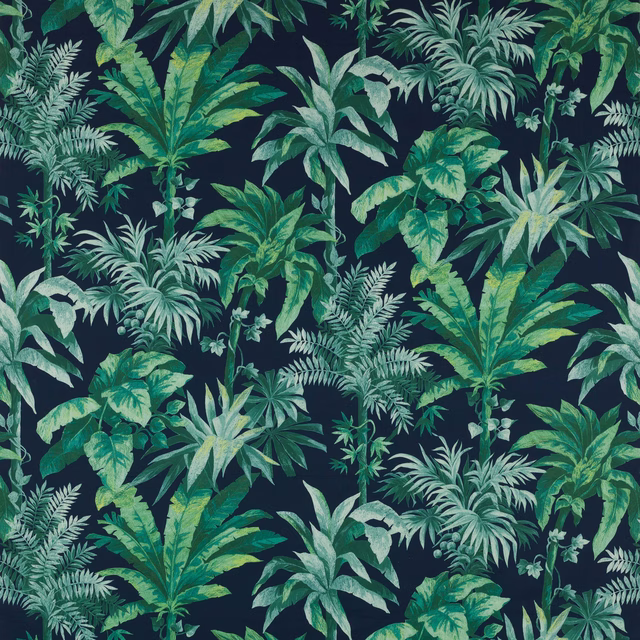 Large tropical leaf print in greens on a deep navy cotton ground
