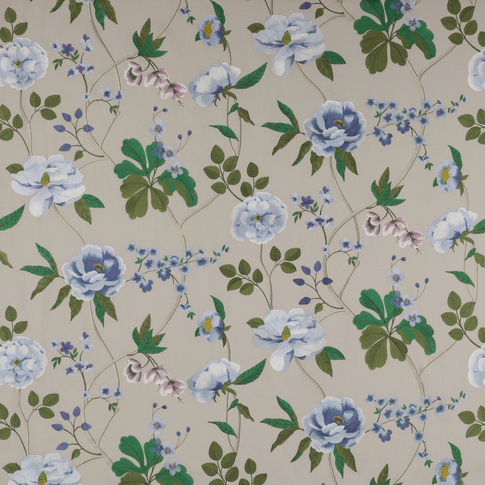 Pale blue floral fabric with green leaves on a cream ground