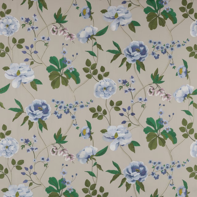 Pale blue floral fabric with green leaves on a cream ground