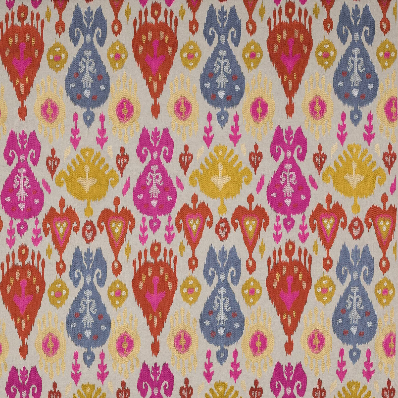 Cream woven fabric with large ikat-style motifs in coral, blue, magenta and gold