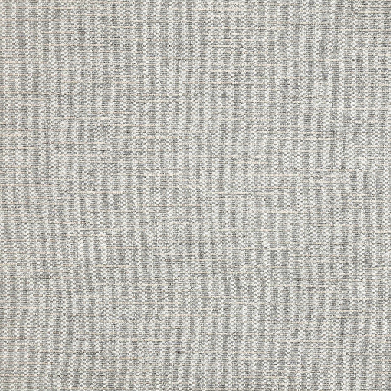 Close-up of a softly textured dusty blue woven fabric with fine slubbed threads