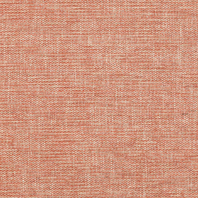 Close-up of muted coral-red woven fabric with a fine slub texture