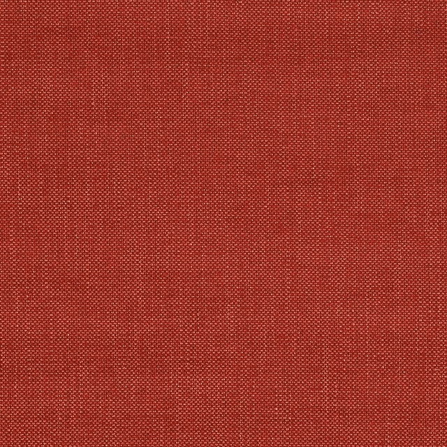 Close-up of a warm brick-red plain woven fabric with fine textured surface