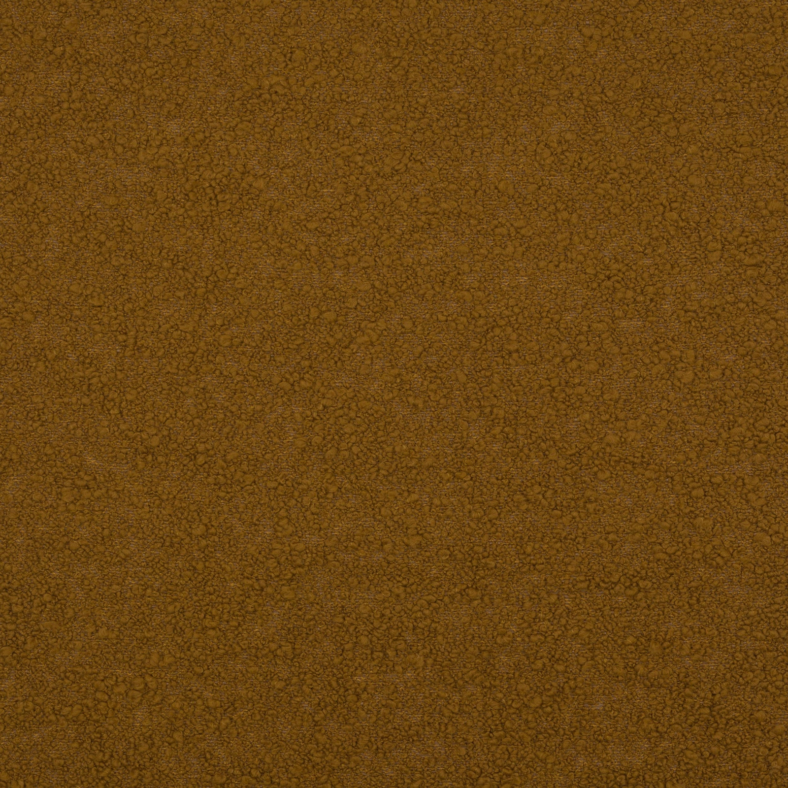 Close-up of a saffron gold textured woven fabric with fine pebble-like surface