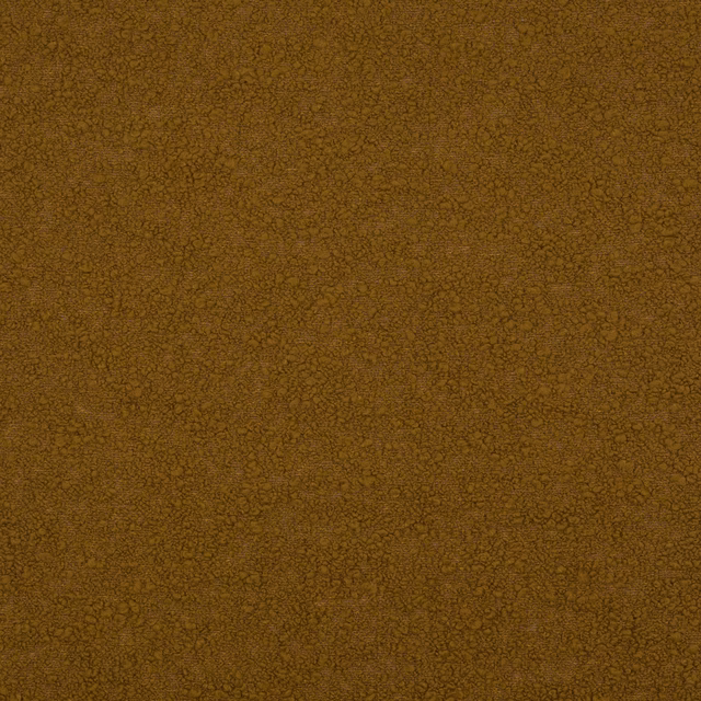 Close-up of a saffron gold textured woven fabric with fine pebble-like surface