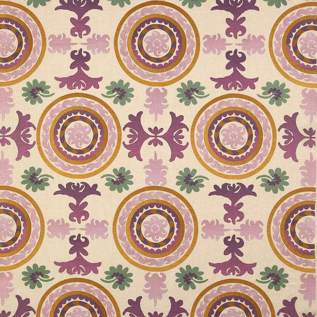 Ivory woven fabric with repeating amethyst medallions, plum motifs and blush accents