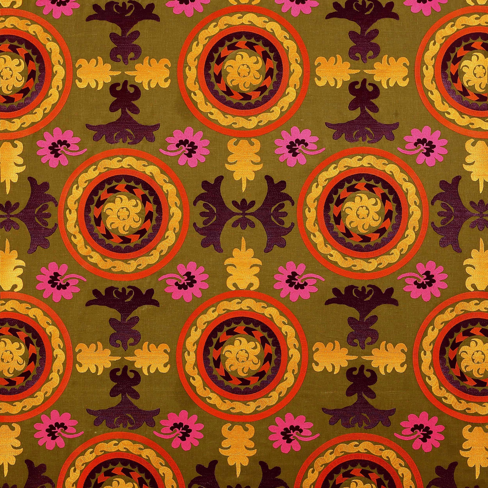 Olive green patterned fabric with circular medallions, pink florals and plum motifs
