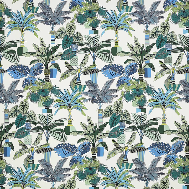 Large tropical palm and leaf print in marine blue, aqua and green on a pale ground