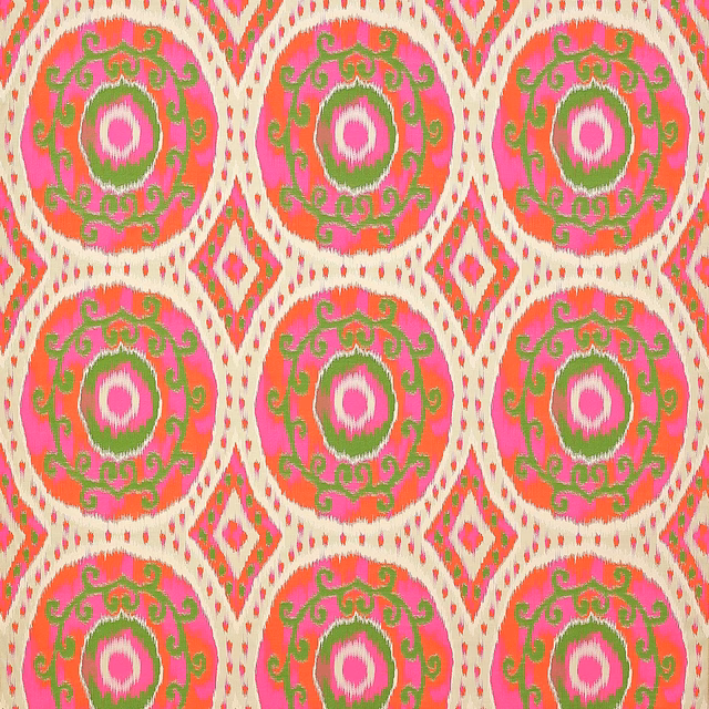 Bright pink and green circular medallion fabric with ivory lattice weave