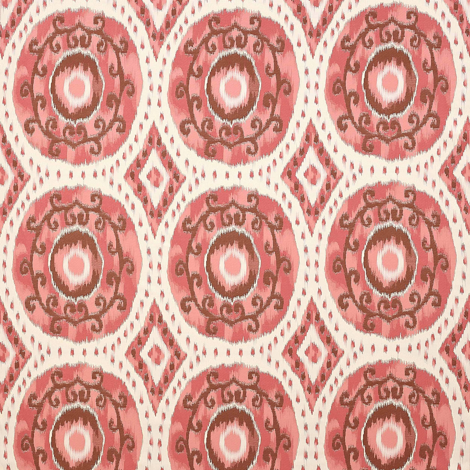 Warm pink patterned fabric with circular medallions and brown scroll detailing