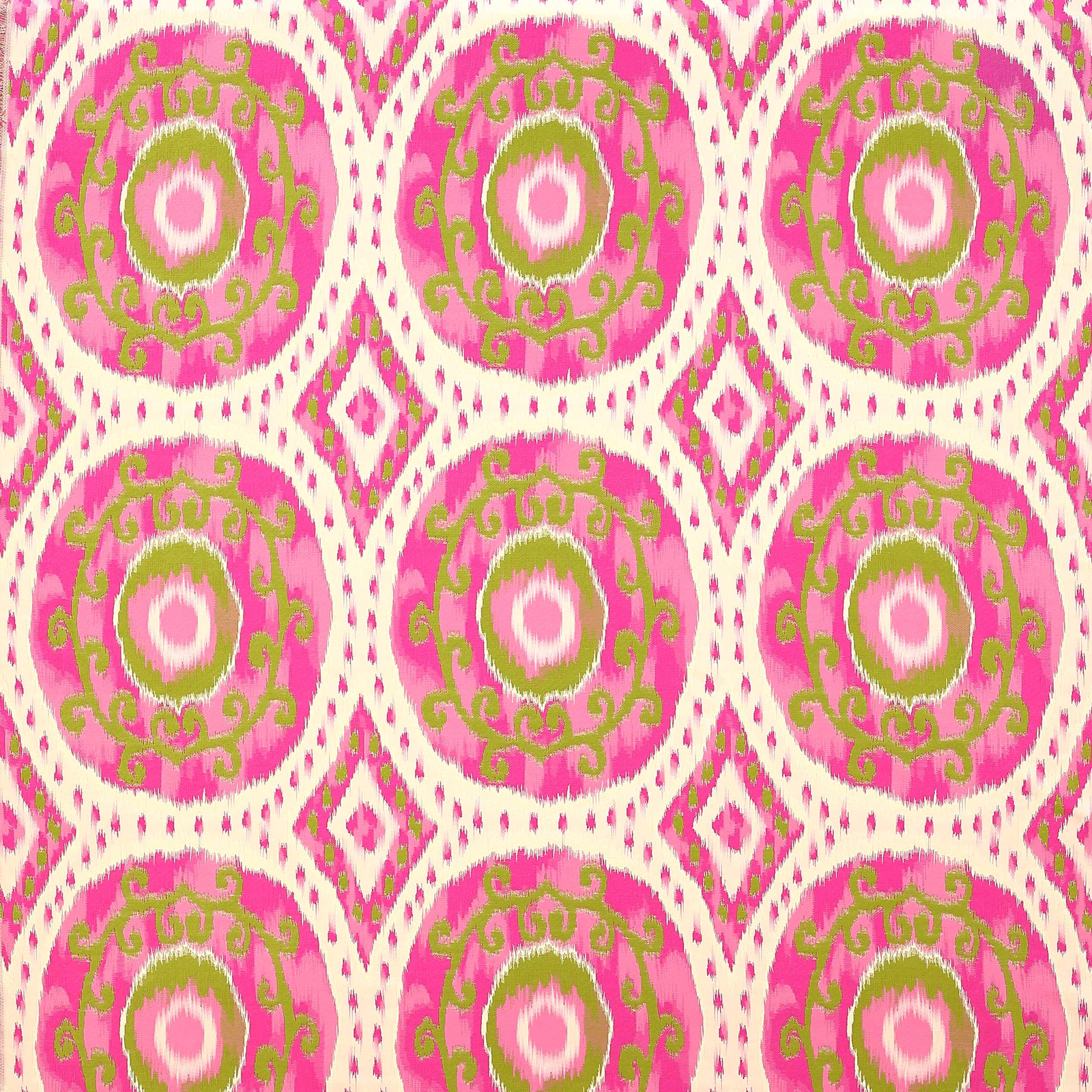 Bright fuchsia patterned fabric with green circular medallions and cream diamond accents