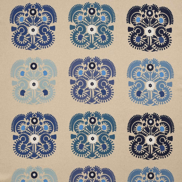 Blue damask motif on a pale neutral woven ground