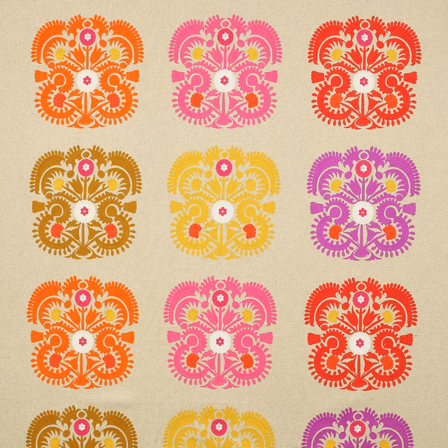 Beige fabric swatch with bold multicolour floral damask medallions