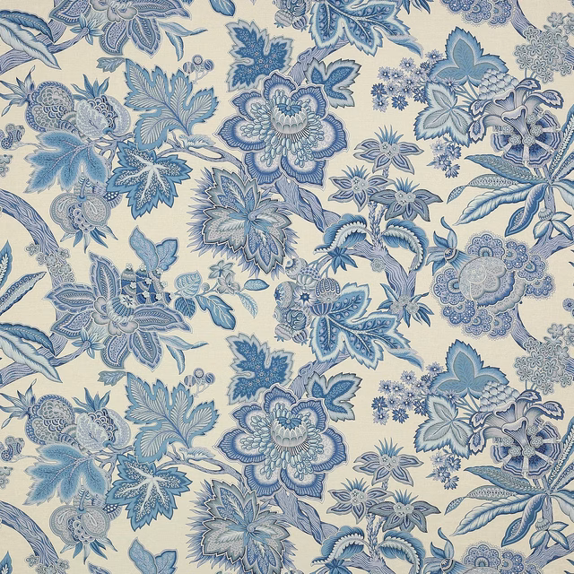 Blue floral linen fabric with detailed layered blossoms on an ivory ground
